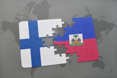 bir dünya haritası arka plan üzerinde Finlandiya ve Haiti ulusal bayrağı ile bulmaca.
