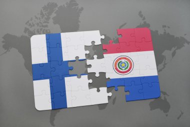 bir dünya haritası arka plan üzerinde finlandiya ve paraguay ulusal bayrağı ile bulmaca.