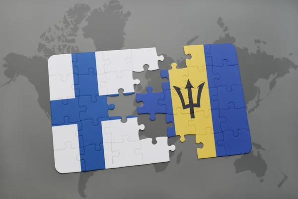 Bir dünya haritası arka plan üzerinde finlandiya ve barbados ulusal bayrağı ile bulmaca. — Stok fotoğraf