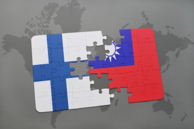 bir dünya haritası arka plan üzerinde Finlandiya ve Tayvan ulusal bayrağı ile bulmaca.