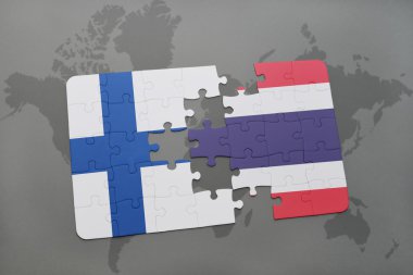 bir dünya haritası arka plan üzerinde Finlandiya ve Tayland ulusal bayrağı ile bulmaca.