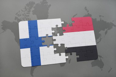 bir dünya haritası arka plan üzerinde Finlandiya ve Yemen ulusal bayrağı ile bulmaca.