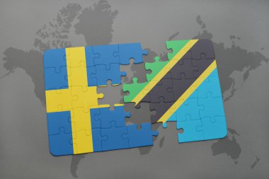 bir dünya haritası arka plan üzerinde İsveç ve Tanzanya ulusal bayrağı ile bulmaca.