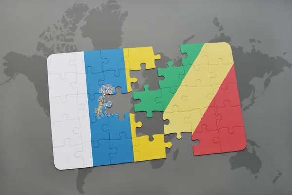 Puzzle a világ megjelenítése háttér a Kongói Köztársaság és a Kanári-szigetek zászlaja. — Stock Fotó