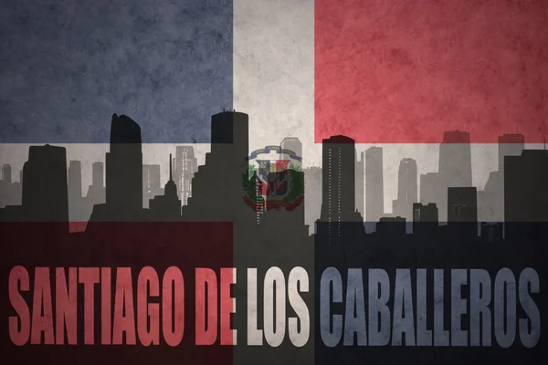 Streszczenie sylwetka miasta z tekstem Santiago de los Caballeros, na vintage flagę Dominikana — Zdjęcie stockowe