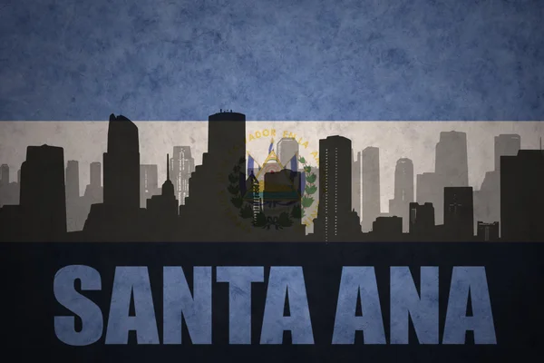 Abstract silhouette of the city with text Santa Ana at the vintage salvadoran flag — Stock Photo, Image