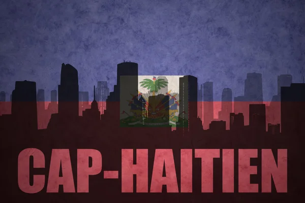 Silueta abstracta de la ciudad con texto Cap-Haitien en la bandera haitiana vintage —  Fotos de Stock