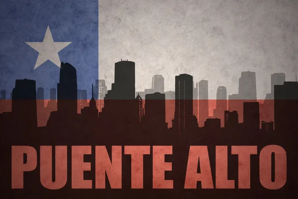 Abstract silhouette of the city with text Puente Alto at the vintage chilean flag — Stock Photo, Image