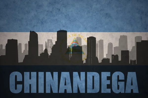 Abstrakte silhouette der stadt mit text chinandega auf der vintage nicaraguan flag — Stockfoto
