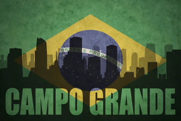 Abstract silhouette of the city with text Campo Grande at the vintage brazilian flag — Stock Photo, Image