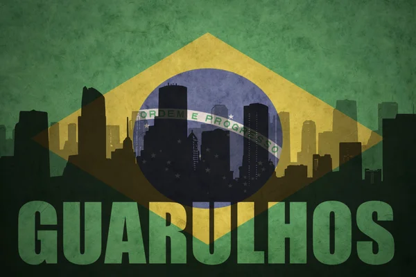 Abstract silhouette of the city with text Guarulhos at the vintage brazilian flag — Stock Photo, Image