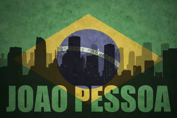 Abstract silhouette of the city with text Joao Pessoa at the vintage brazilian flag — Stock Photo, Image