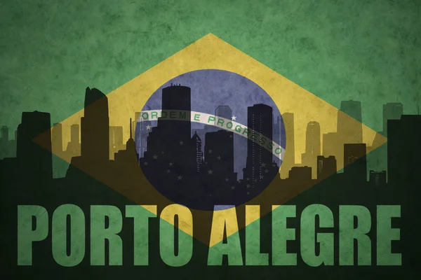 Abstract silhouette of the city with text Porto Alegre at the vintage brazilian flag — Stock fotografie
