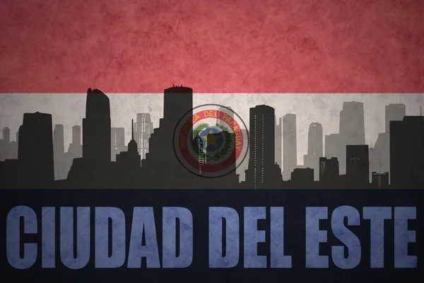 Abstract silhouette of the city with text Ciudad del Este at the vintage paraguayan flag — Stock Photo, Image