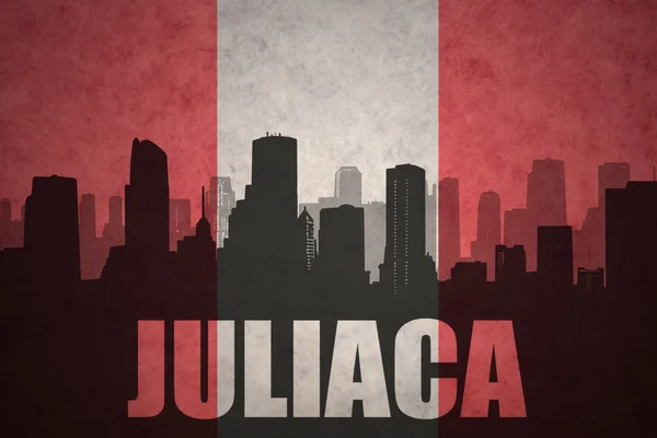 Abstract silhouette of the city with text Juliaca at the vintage peruvian flag — Stock fotografie