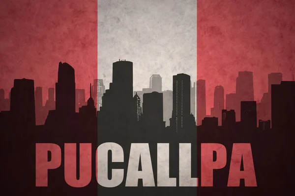 Abstract silhouette of the city with text Pucallpa at the vintage peruvian flag — Stock Photo, Image