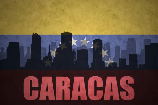 Abstracte silhouet van de stad met tekst Caracas op de vintage Venezolaanse vlag — Stockfoto