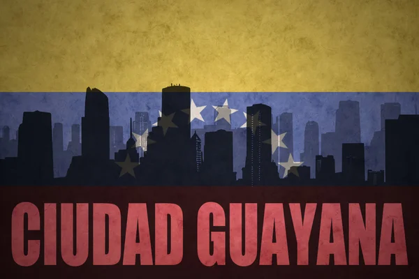 Abstract silhouette of the city with text Ciudad Guayana at the vintage venezuelan flag — Stock Photo, Image