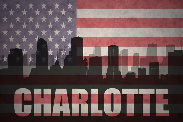Silueta abstracta de la ciudad con texto Charlotte en la bandera americana vintage —  Fotos de Stock