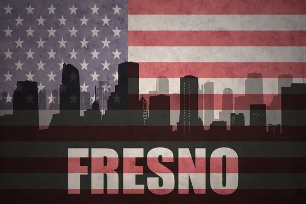 Abstract silhouette of the city with text Fresno at the vintage american flag — Stock Photo, Image