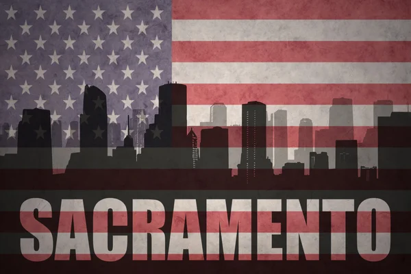 Abstract silhouette of the city with text Sacramento at the vintage american flag — Stock Photo, Image