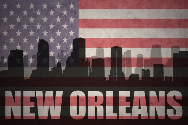 Abstrakta silhuetten av staden med texten New Orleans på vintage amerikanska flaggan — Stockfoto