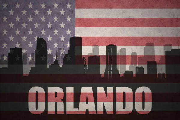 Abstrakta silhuetten av staden med text Orlando på vintage amerikanska flaggan — Stockfoto