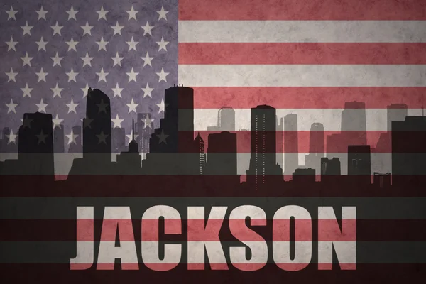 Streszczenie sylwetka miasta z tekstem Jackson o vintage flagi amerykańskiej — Zdjęcie stockowe