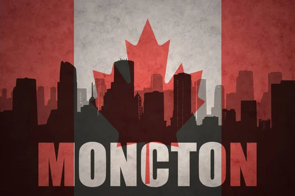 Abstract silhouette of the city with text Moncton at the vintage canadian flag — Stock Photo, Image