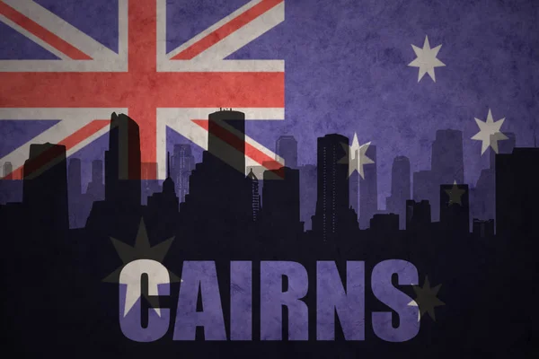 Abstract silhouette of the city with text Cairns at the vintage australian flag — Stock Photo, Image