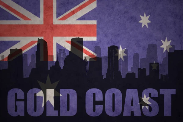 Abstract silhouette of the city with text Gold Coast at the vintage australian flag — Stock Photo, Image