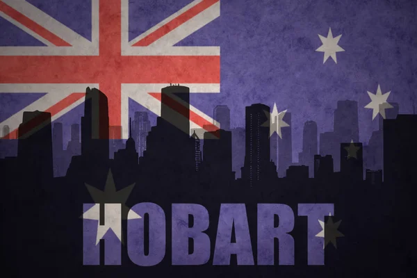 Abstract silhouette of the city with text Hobart at the vintage australian flag — Stock Photo, Image