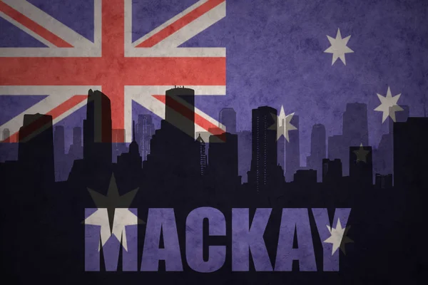 Abstract silhouette of the city with text Mackay at the vintage australian flag — Stock Photo, Image