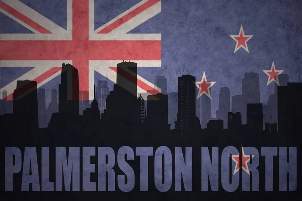 Abstract silhouette of the city with text Palmerston North at the vintage new zealand flag — Stock Photo, Image