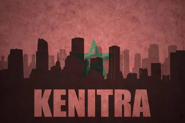 Abstract silhouette of the city with text Kenitra at the vintage moroccan flag — Stock Photo, Image