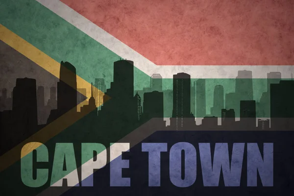 Abstracte silhouet van de stad met tekst Kaapstad op de vintage vlag van Zuid-Afrika — Stockfoto