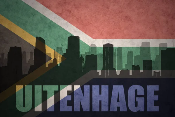 Abstracte silhouet van de stad met tekst Uitenhage op de vintage vlag van Zuid-Afrika — Stockfoto