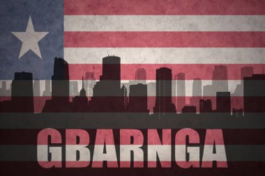 Özet metni Gbarnga vintage Liberya bayrağı ile şehir silüeti