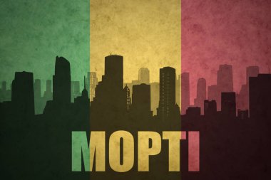 abstract silhouette of the city with text Mopti at the vintage malian flag clipart