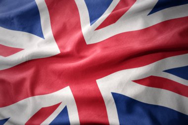 Büyük Britanya'nın renkli bayrak sallayarak.