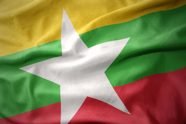 Schwenken bunte Flagge der Myanmar. — Stockfoto