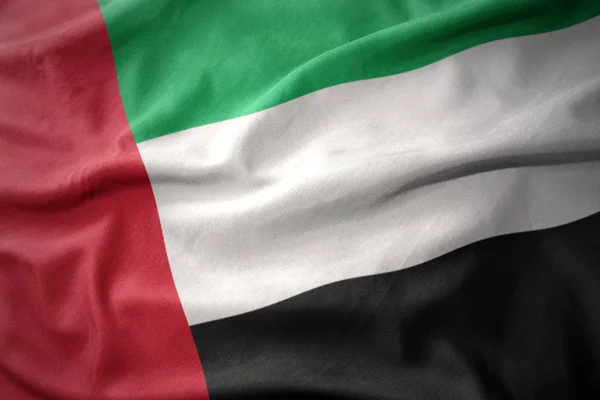 Ondeando colorida bandera de los emiratos árabes unidos . — Foto de Stock