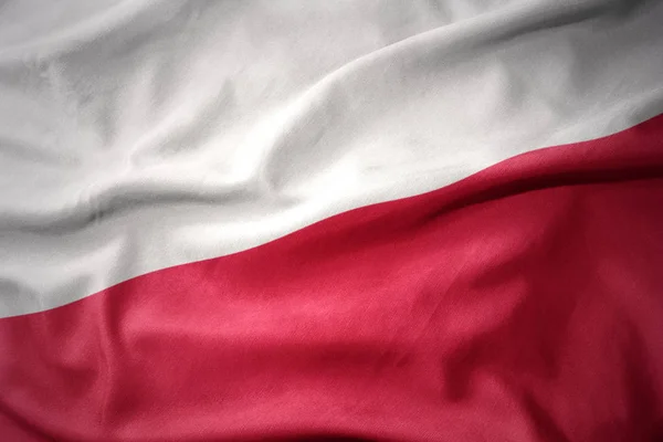Mává barevná vlajka Polska. — Stock fotografie