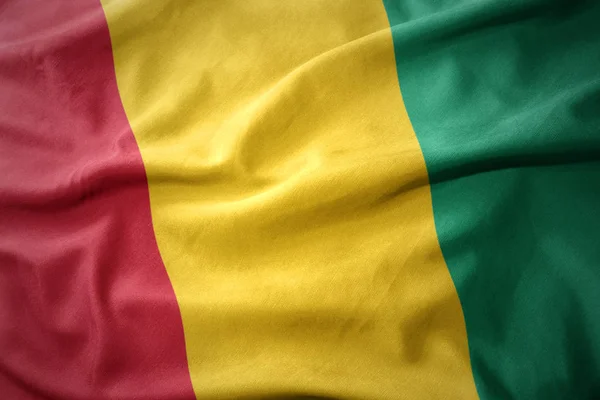 Waving colorful flag of guinea. — Stock Photo, Image