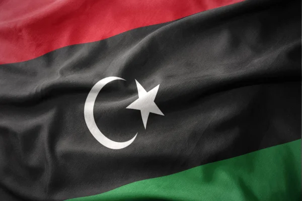 Wuivende kleurrijke vlag van Libië. — Stockfoto