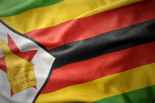 Acenando bandeira colorida de zimbabwe . — Fotografia de Stock