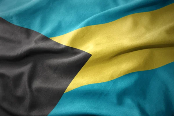 Waving colorful national flag of bahamas. — Stock Photo, Image