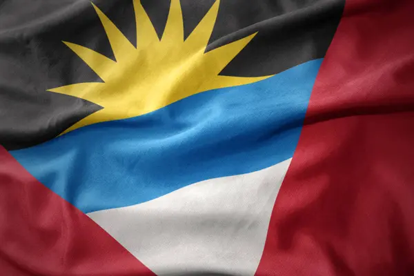 Waving colorful flag of antigua and barbuda. — Stock Photo, Image