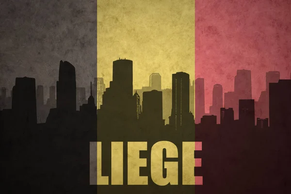 ビンテージのベルギーの旗で本文リエージュ市内の抽象的なシルエット — ストック写真