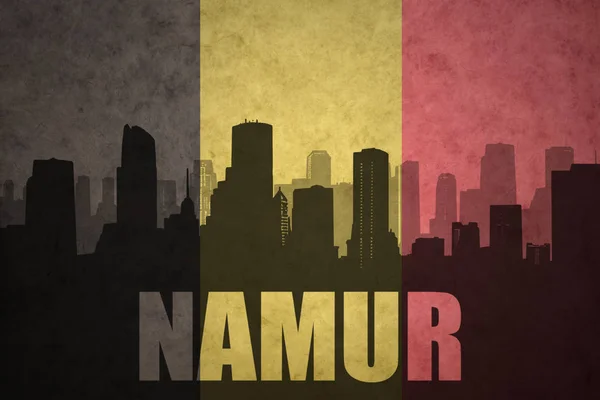 Silueta abstracta de la ciudad con texto Namur en la bandera de Bélgica vintage — Foto de Stock